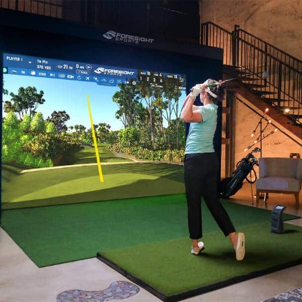 Woman Playing on Foresight Sports Sim-in-a-Box: Birdie Plus Package