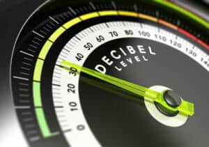 Image of a decibel level reader with the needle pointing at 30 decibels