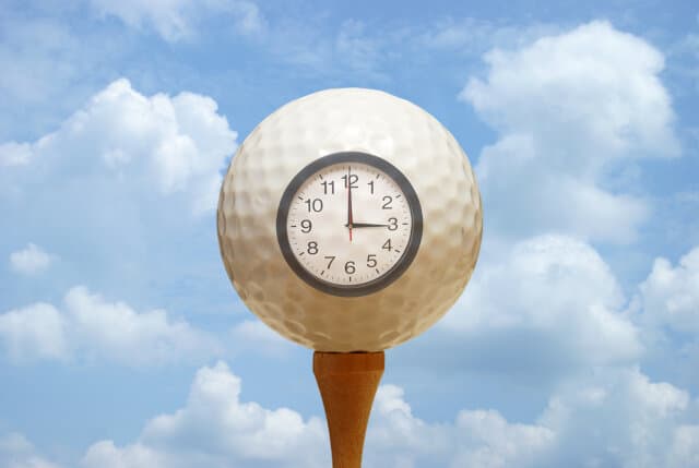 Tee Time Clock on a golf ball illustration
