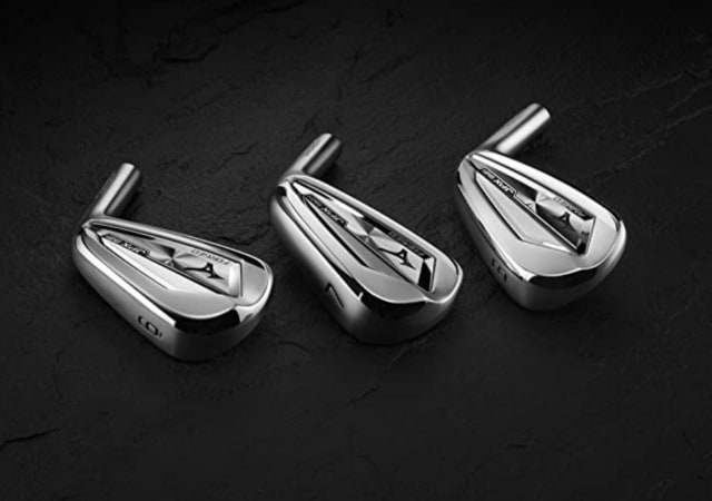 Mizuno JPX921 Forged Iron clubheads on a black surface
