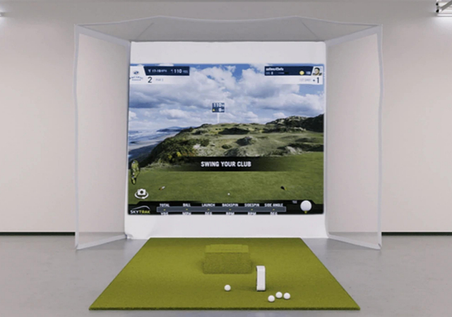 Complete SkyTrak Flex Space Package indoor setup with golf balls on the hitting mat