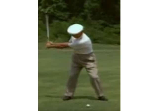 Ben Hogan performing a golf swing on the golf course