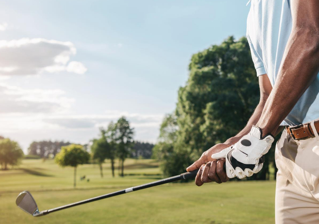 A golfer showing his golf grip on the golf course
