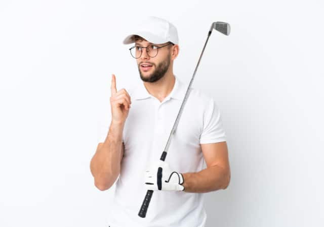 Golfer holding a golf club on white background