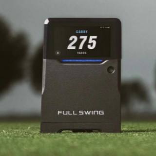 Full Swing Kit Launch Monitor on the grass outdoors